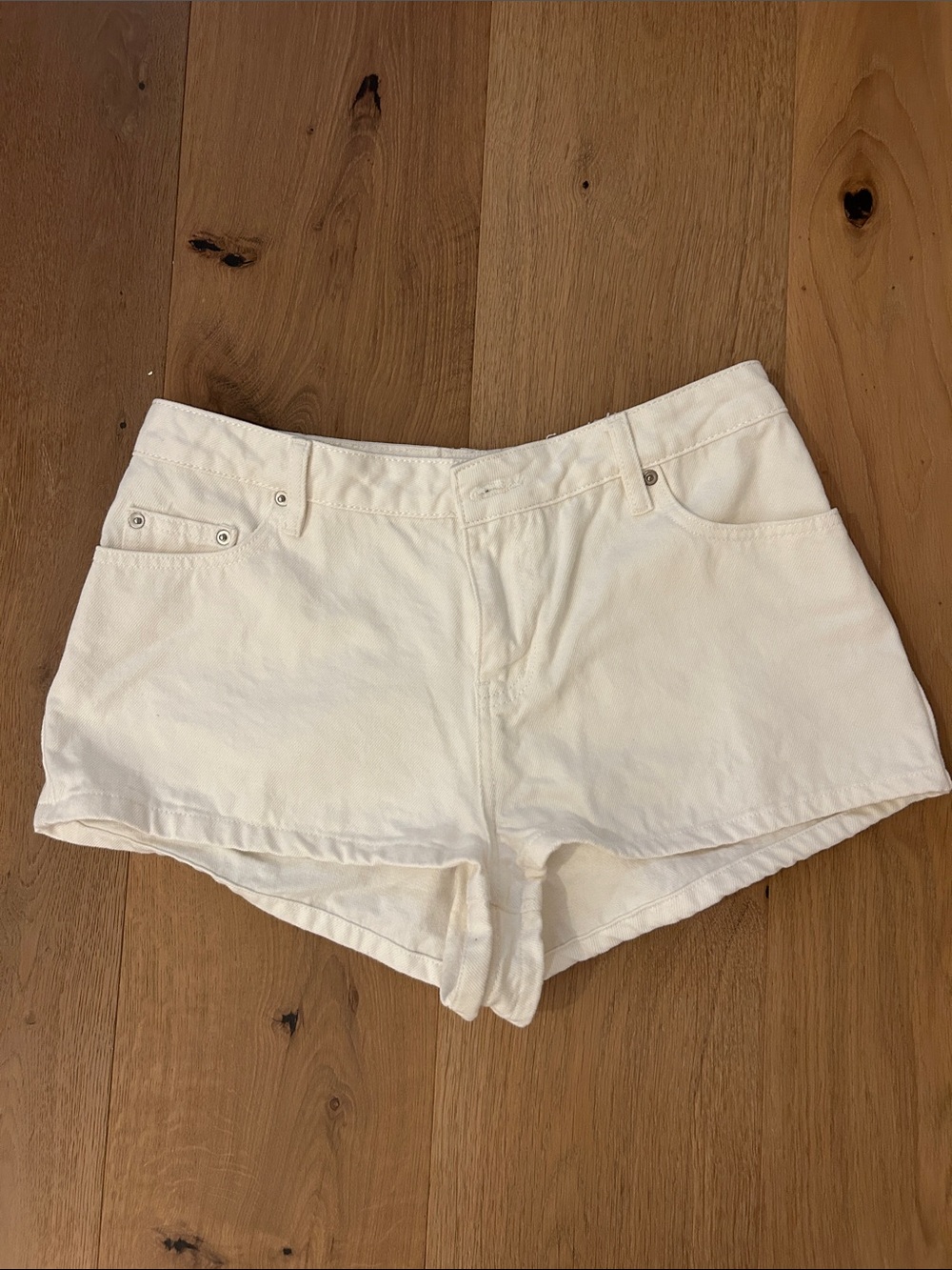 Princess Polly mid rise white denim jean shorts